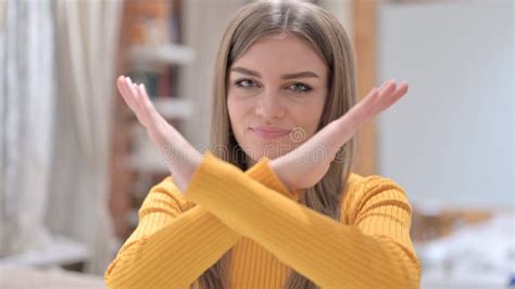 Portrait Of Serious Young Woman Saying No By Hand Gesture Stock Image