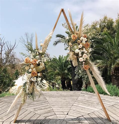 Plain Jane Posy Boho Triangle Wedding Arch Floral Arrangements