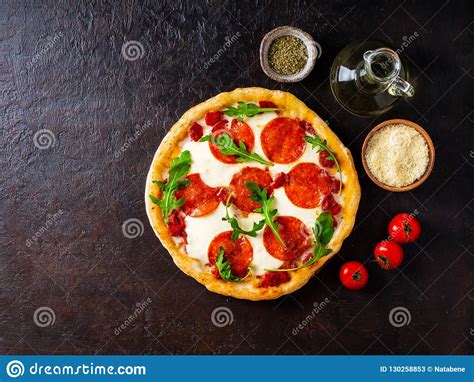 Hot Homemade Italian Pepperoni Pizza With Salami Mozzarella On Stock