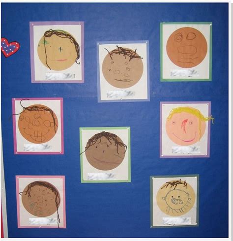 A Bulletin Board With Pictures Of Childrens Faces On It