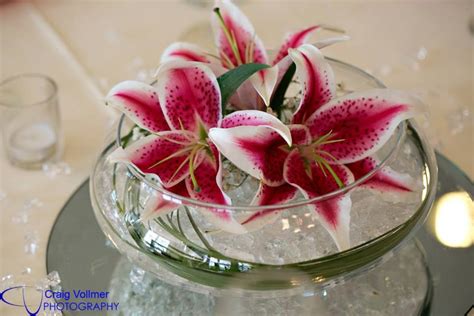 Centerpiece bowls is a simple way to make center of attention for any room. Stargazer lily Lotus Bowl Table Centerpiece Florals by ...