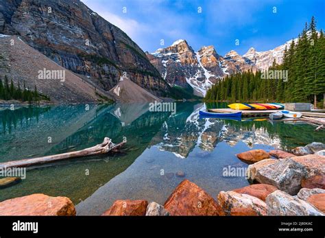 Moraine Lake Reflection And Canoes Canadian Rockies Banff National