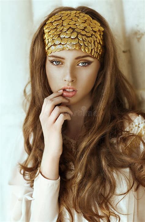 Young Beautiful Girl With Long Hair And Gold Fashion Crown Stock Image