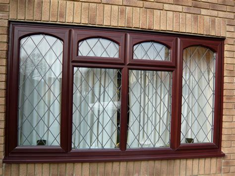Dark Brown Leaded Windows With Arched Rim