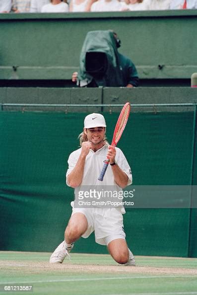 American Tennis Player Andre Agassi Pictured On His Knees During