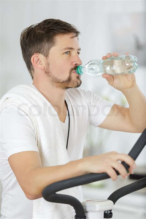 Man Drinking Water During Exercise Stock Image Colourbox