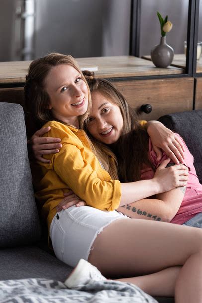 Two Lesbians Kissing While Sitting On Sofa Free Stock Photo And Image