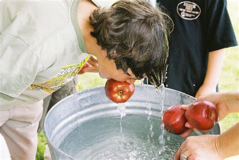 Apple Bobbing Is A Game Often Played On Halloween Apples Float In A Basin Full Of Water