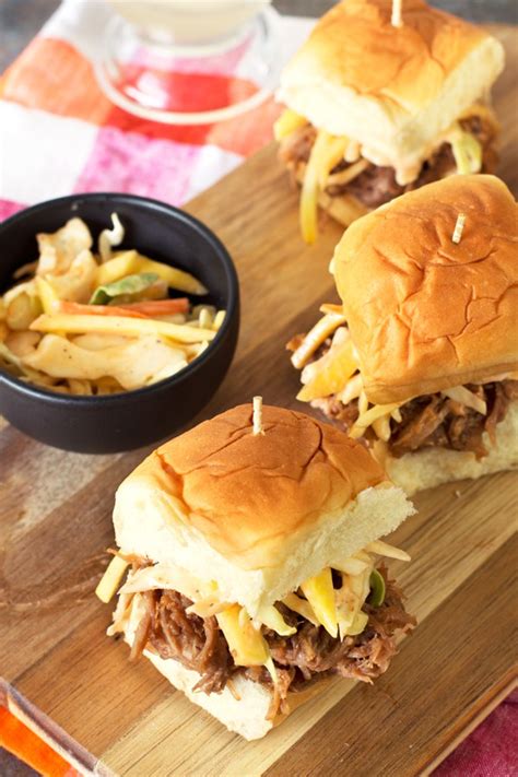 Homemade pickles give this classic bbq sandwich a whole new outlook when combined with slider buns. Tropical Pulled Pork Sliders with Mango Coleslaw - Cake 'n Knife