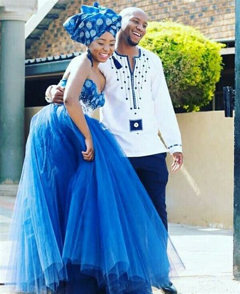 clipkulture tswana bride in beautiful blue strapless shweshwe wedding gown with doek