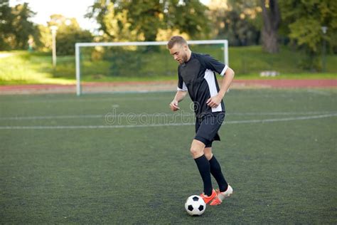 Soccer Player Playing With Ball On Football Field Stock Image Image