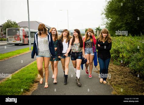 A Group Of Six 6 Young Adolescent British English Welsh Teen Teenage Girls Friends Walking