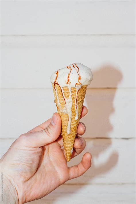 Hand Holding Ice Cream Cone By Stocksy Contributor Jesse Morrow Stocksy
