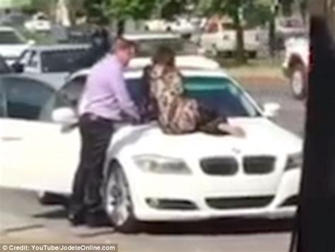 Wife Sits On Her Cheating Husbands Bmw To Stop Him Driving Off With