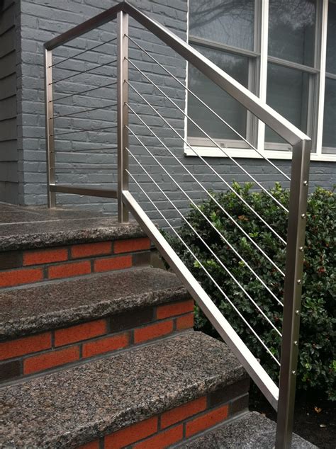 Stainless steel rod railing for a scenic home. Colonial Iron Works - Iron Exterior Handrails