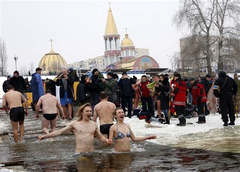 Orthodox Christians Bathe In Icy Waters To Mark Epiphany Daily Mail