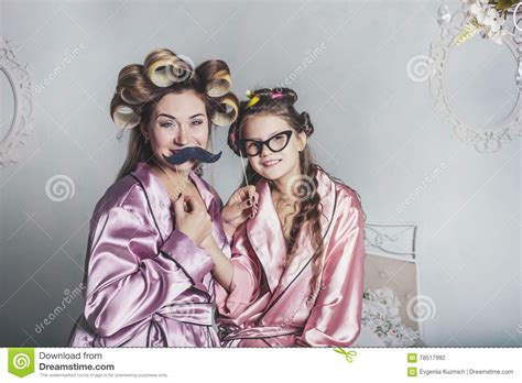Mother and Daughter Alone at Home Beautiful, Fashionable and Fun Stock
