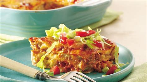 This tasty chicken enchilada casserole recipe is made with diced, cooked chicken and a sour cream sauce with green chile, mushrooms, and seasonings. Layered Chile-Chicken Enchilada Casserole Recipe - BettyCrocker.com