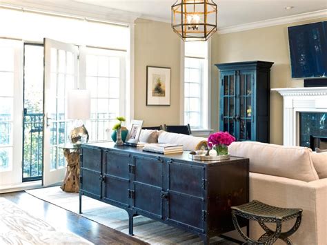 It is also a very cool idea for something like books because you can easily reach them on the lower shelves while lounging on the couch itself. Neutral Living Room Condo With Antique Sideboard ...