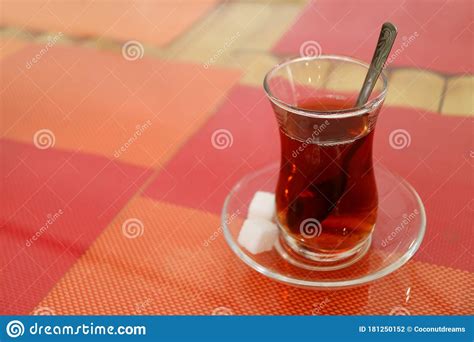 Hot Turkish Tea In Tulip Shaped Glass With Sugar Cubes Isolated On