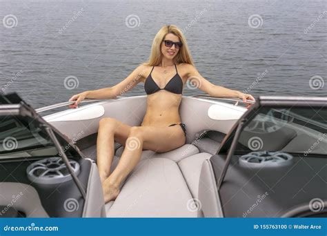 Beautiful Bikini Model Relaxing On A Boat By The Docks Stock Photo My XXX Hot Girl