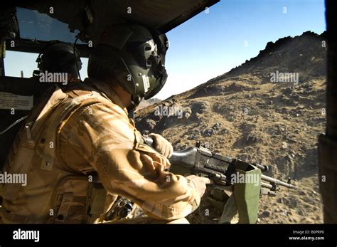 Door Gunner In A British Military Helicopter Over Helmand Province