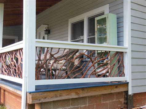 Metal railing and single white painted door front porch. Porch Railings From Cherokee, NC | Deck Railing Ideas