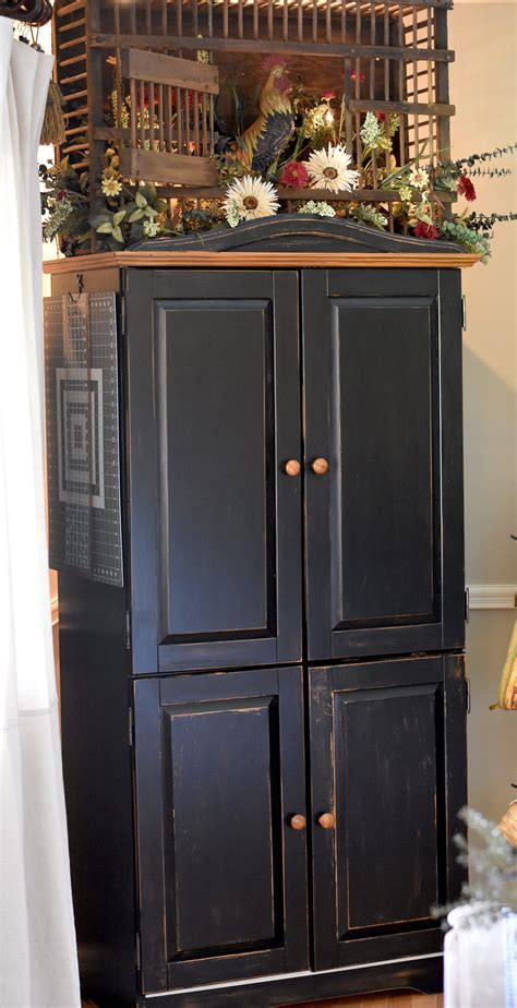 An armoire doesn't have to belong in a bedroom. Craft Armoire with Folding Sewing Table | Folding sewing ...