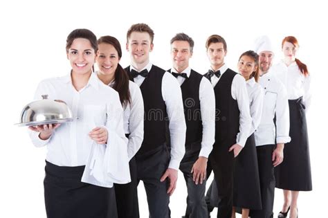 Large Group Of Waiters And Waitresses Standing In Row Stock Photo