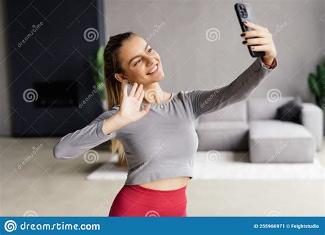 Young Smiling Sporty Athletic Fitness Trainer Instructor Woman Doing