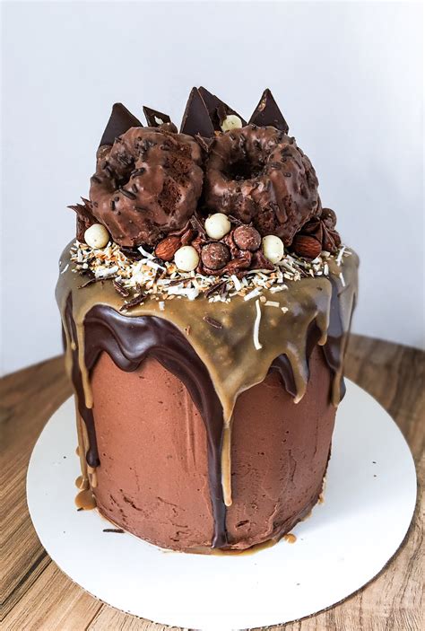 A spicy chocolate cake topped with a rich decadent chocolate frosting spiked with bourbon. German Chocolate Celebration Cake - Kellie Rice Cakes