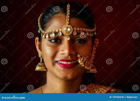 Portrait Indian Beautiful Female In Golden Rich Jewelery And Tradition