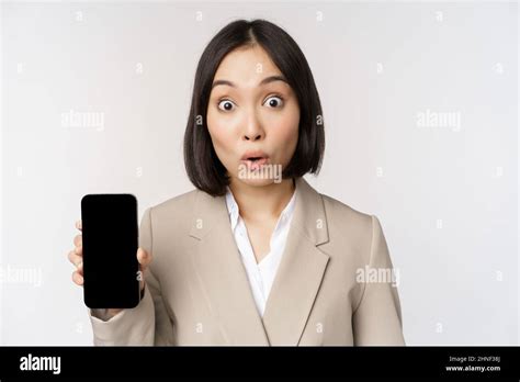 Image Of Asian Corporate Woman Showing App Interface Mobile Phone