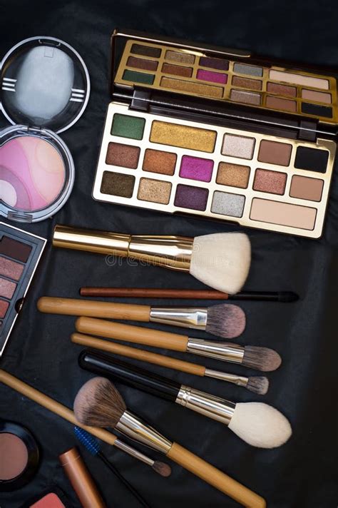 Set Of Make Up Brushes With Cosmetics On Black Background Stock Image