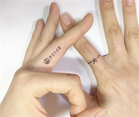 Татуировка на пальце точка с лучами значение много фото inkedink ru