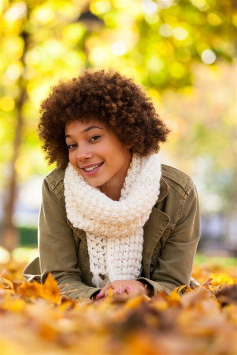 Autumn Outdoor Portrait Of Beautiful African American Young Woman Lying