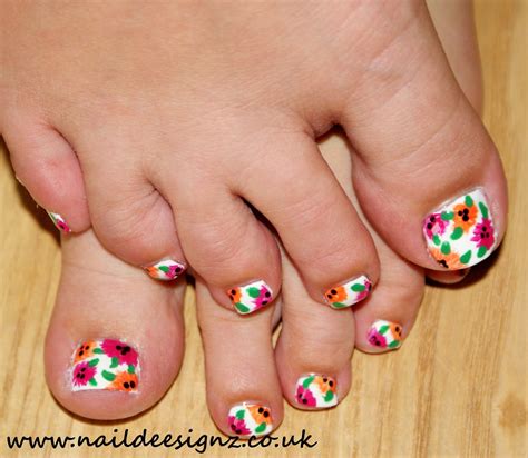 Before you go get your pedicure, you're going to need some inspiration and ideas on what to put on your toes. NailDeesignz: Summer Flowers Pedicure