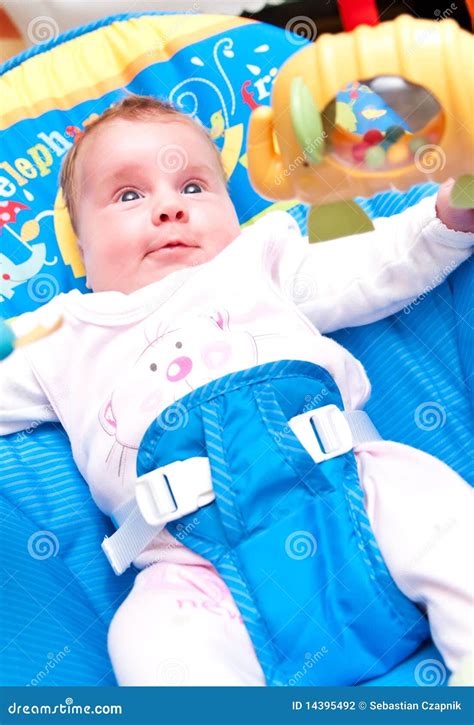 Baby In A Bouncer Stock Photo Image Of Caucasian Toys 14395492