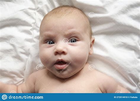 Closeup Portrait Of Newborn Baby On White Blanket Soft Focus Infant