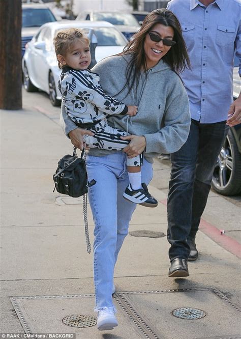 Kourtney Kardashian Carries Son Reign To Ice Skating Rink Daily Mail Online