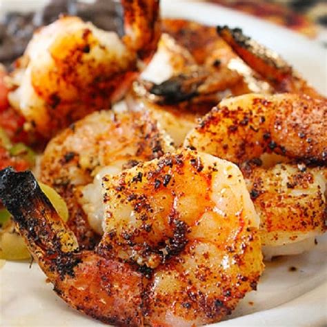 Smoky flavors from the barbecue and bold spices take this succulent seafood to the next level. Best Grilled Marinated Shrimp Recipe | Magic Skillet