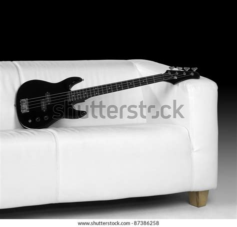 Black Bass Guitar On White Couch Stock Photo 87386258 Shutterstock