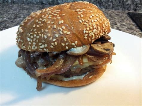 While the burgers are cooking saute the freshly sliced mushrooms and onions over medium heat until deep brown and tender. Caramelized onion/Mushroom Burger with Swiss Cheese and Roasted Garlic Aioli | Mushroom burger ...