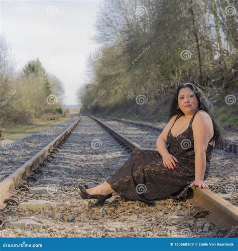 Woman Sitting On The Train Tracks Looking At You Stock Image Image Of