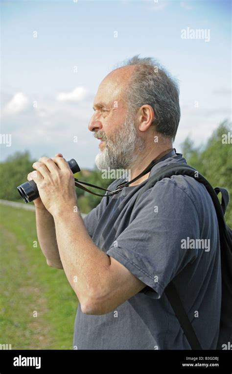 Male Birdwatcher With Binoculars London Uk Stock Photo Alamy