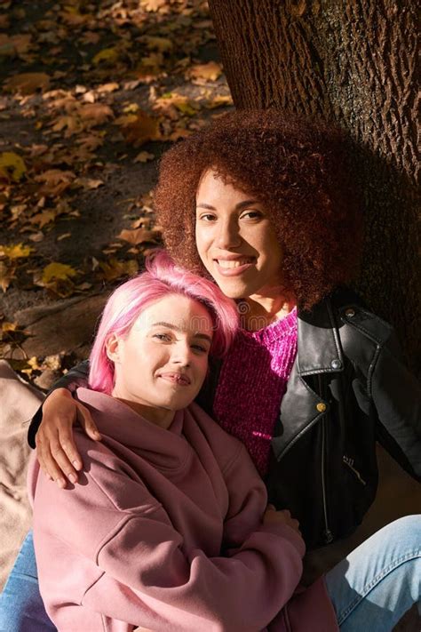 Happy Interracial Lesbian Couple Resting In Park Stock Image Image Of