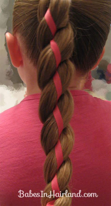 They are such an easy hairstyle and there are all sorts of ways to dress them up or down. 4 Strand Braid with Ribbon In It - Babes In Hairland