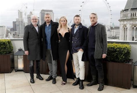 Jennifer Lawrence Fires Back At Critics Over Plunging Dress At London Photocall