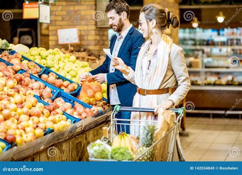 Couple Buying Fresh Food In The Supermarket Stock Photo Image Of