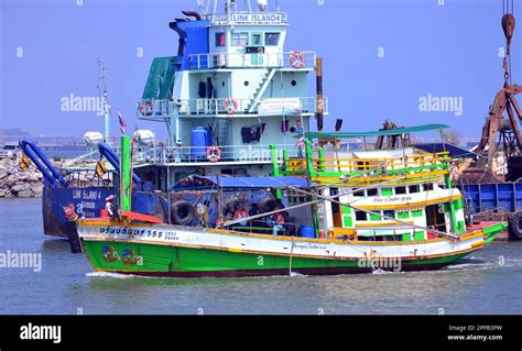 A Colourful Thai Fishing Boat Arrives At The Harbour On The Rayong
